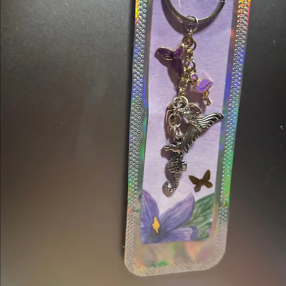Silver keychain with charms‎